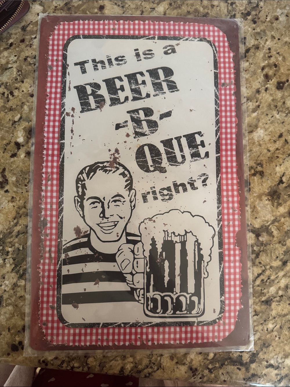 This is a BEER-B-QUE Vintage Style Wall Plaque - Red & White